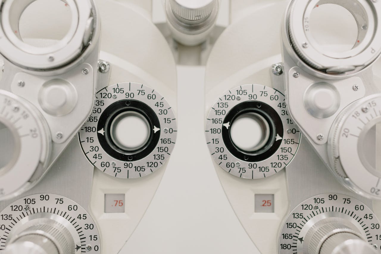 Detailed view of a phoropter used for precise eye exams in a clinical setting.